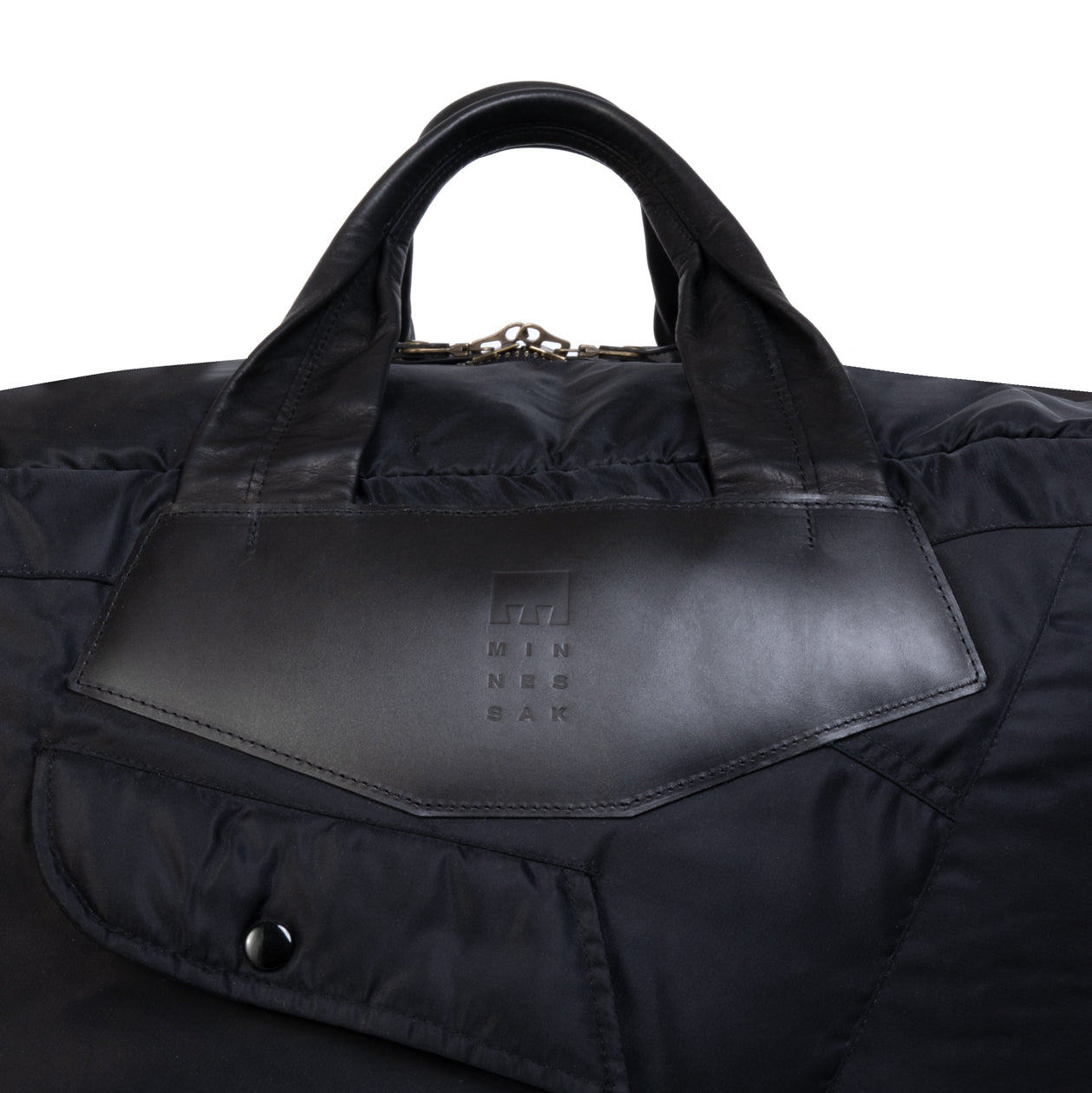 Black leather bag with handle and visible brand logo on a white background