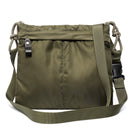Green shoulder bag with a strap on a white background
