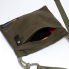 Olive canvas bag with a zipper on a white background