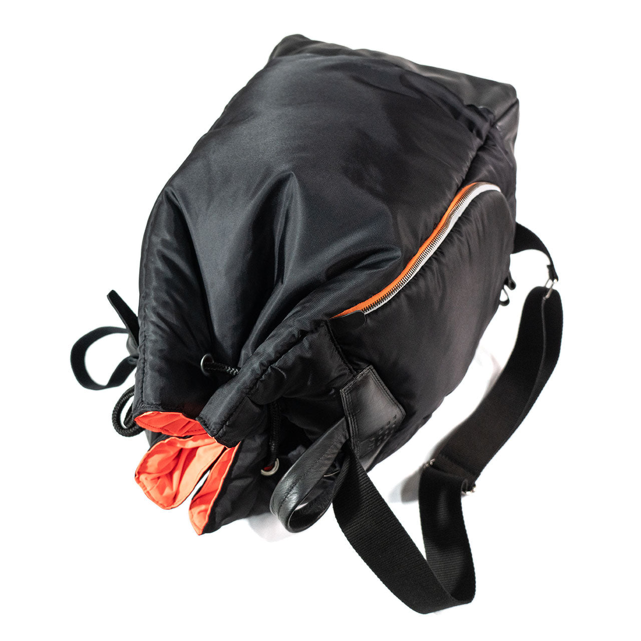 Black backpack with orange accents on a white background