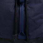 Close-up of a navy blue jacket with a zipper