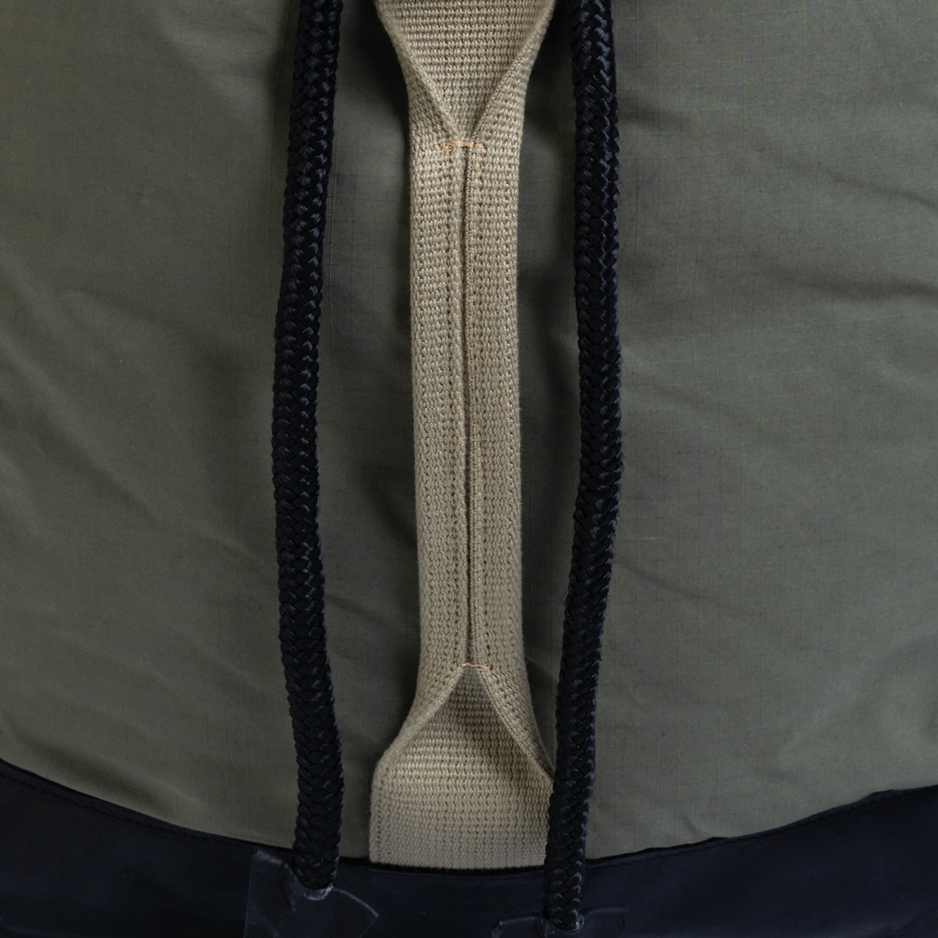 Close-up of a zipper on a jacket with a focus on texture and design.