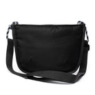 Black shoulder/cross body bag with strap on white background