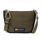 Small shoulder/cross body bag showing distinctive cord detail and MInnessak logo on white background