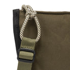 Olive shoulder/cross body bag showing strap detail on white background