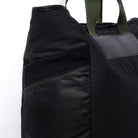 Large black tote bag pocket detail on white background