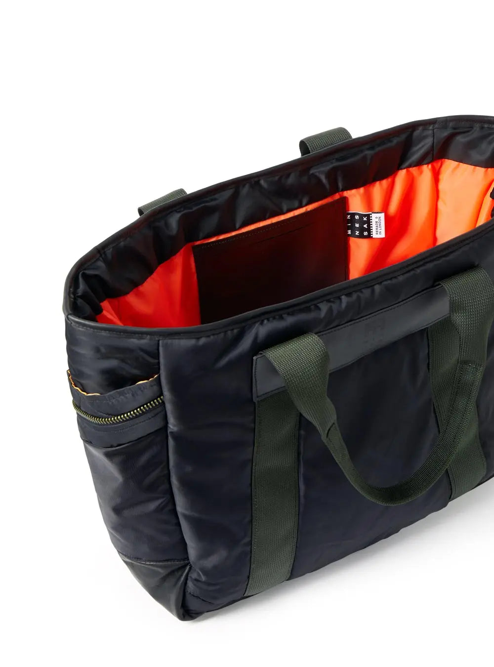 Black and green bag with orange interior on a white background
