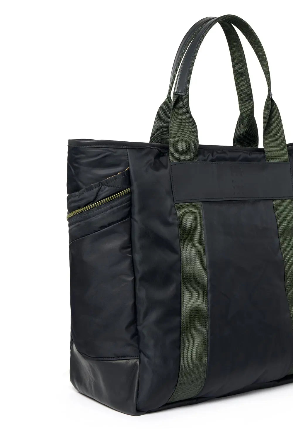 Black tote bag with green handles and zipper on a white background