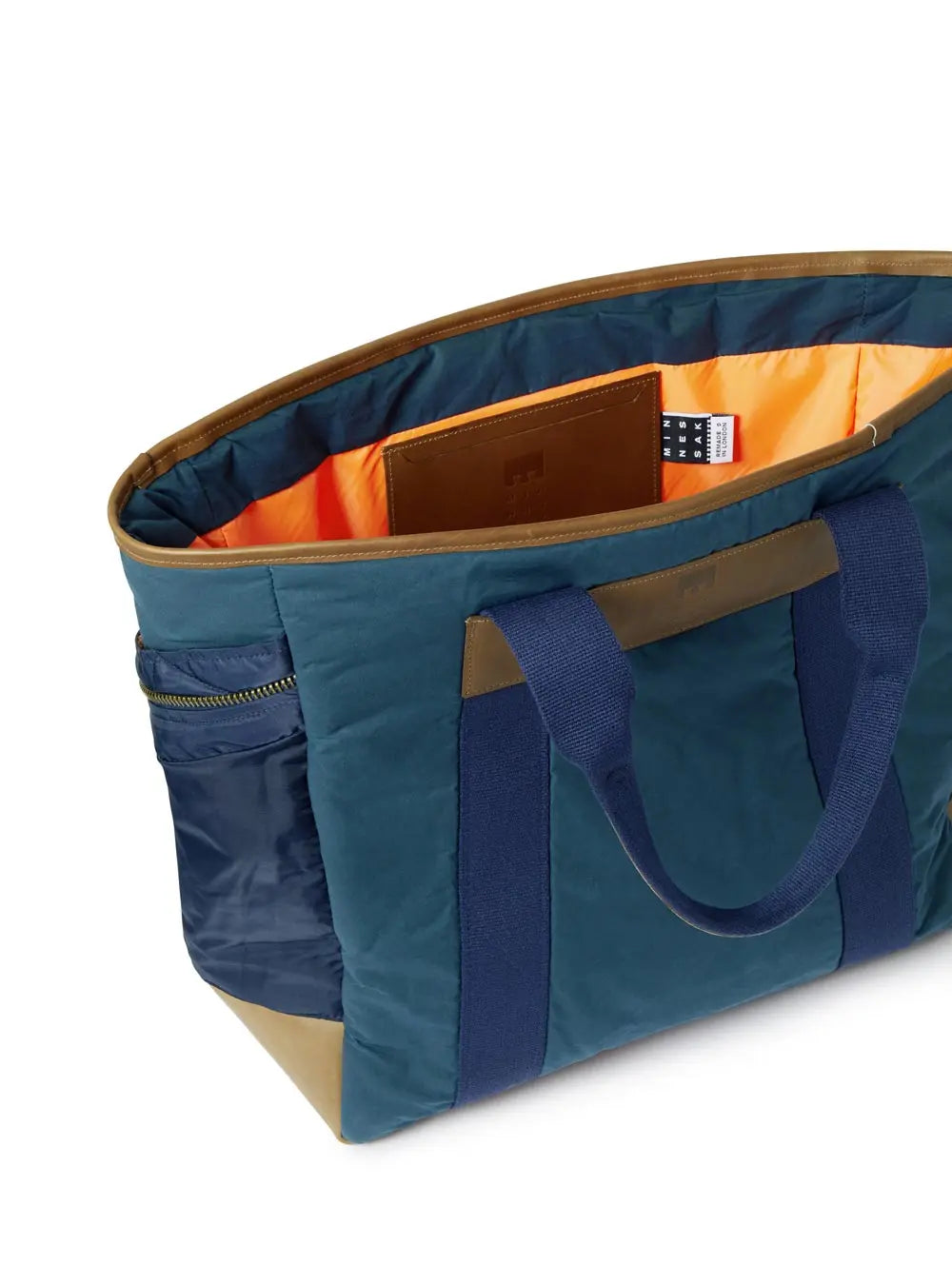 Navy Blue and brown tote bag with orange interior on a white background